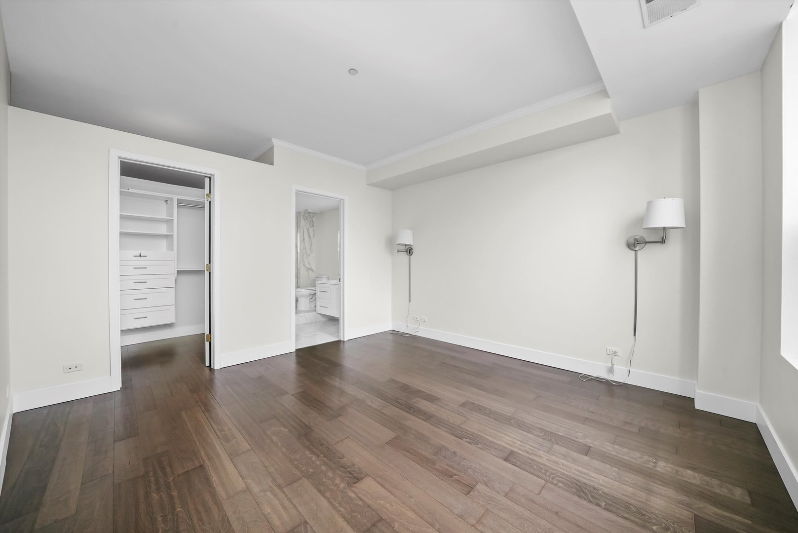 910 South Michigan Avenue, Unit 1612 Chicago, IL 60605 - Photo 7 of 17 a view of an empty room with wooden floor