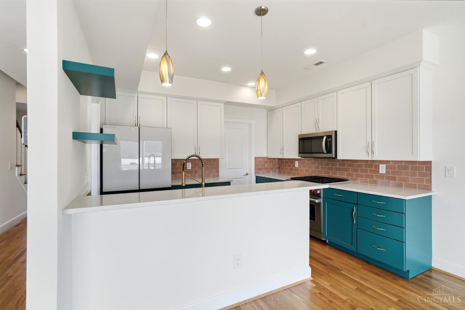 3003 Riverside Drive Cincinnati, OH 45226 - Photo 12 of 65 The kitchen features new countertops, a Rookwood tiled backsplash, new appliances, including a Wolf gas cook-top oven/range, spacious pantry, counter-bar seating, pendant lighting and floating shelves.
