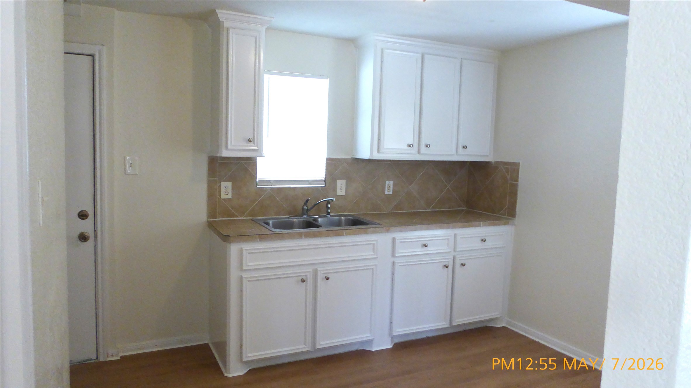 2308 Stevens Street Houston, TX 77026 - Photo 3 of 12 a kitchen with white cabinets