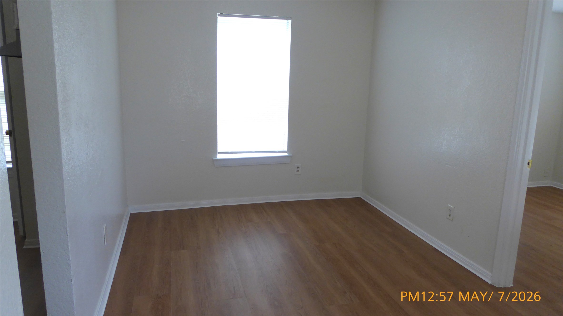 2308 Stevens Street Houston, TX 77026 - Photo 6 of 12 an empty room with wooden floor and windows