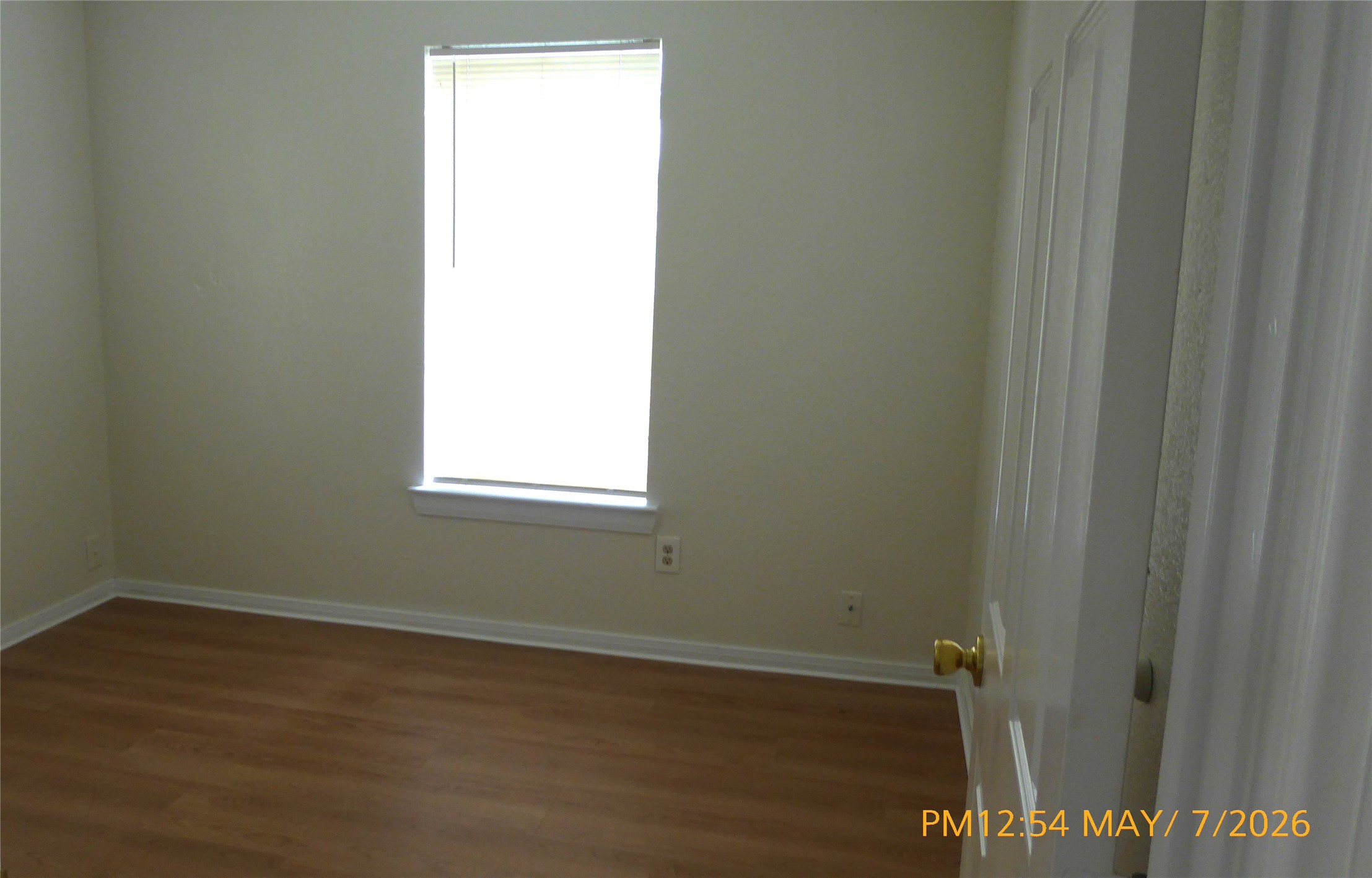 2308 Stevens Street Houston, TX 77026 - Photo 7 of 12 a view of a small space with wooden floor and a window