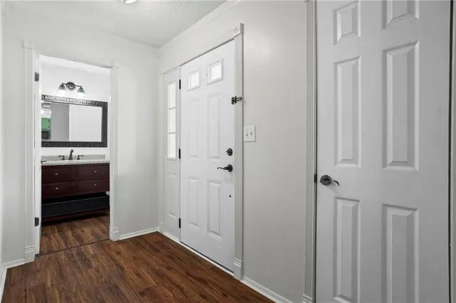 a view of a cabinet and a mirror in a bedroom
