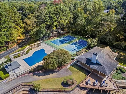 an aerial view of a house with yard swimming pool and outdoor seating