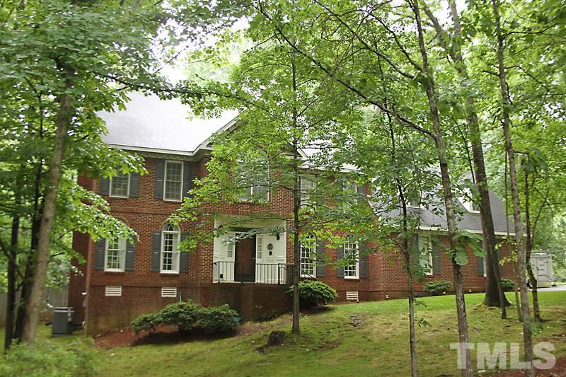 12301 Staunton Court Raleigh, NC 27613 - Photo 1 of 25 a front view of a house with garden