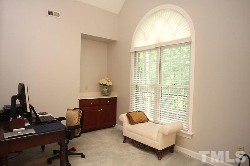12301 Staunton Court Raleigh, NC 27613 - Photo 12 of 25 a bedroom with a workspace