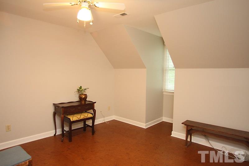 12301 Staunton Court Raleigh, NC 27613 - Photo 17 of 25 a view of a room with wooden floor and chair