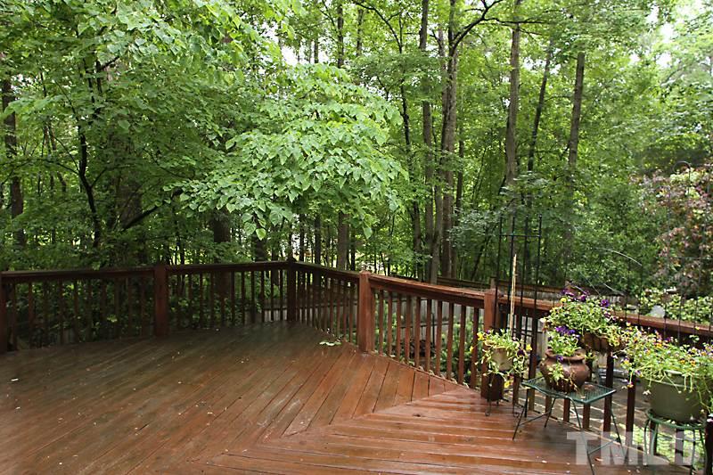 12301 Staunton Court Raleigh, NC 27613 - Photo 20 of 25 a wooden deck with trees