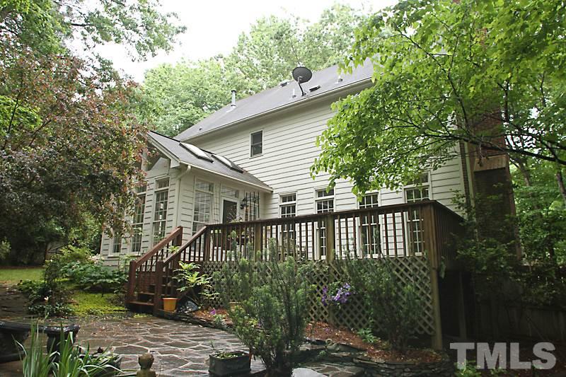 12301 Staunton Court Raleigh, NC 27613 - Photo 22 of 25 a front view of a house with garden