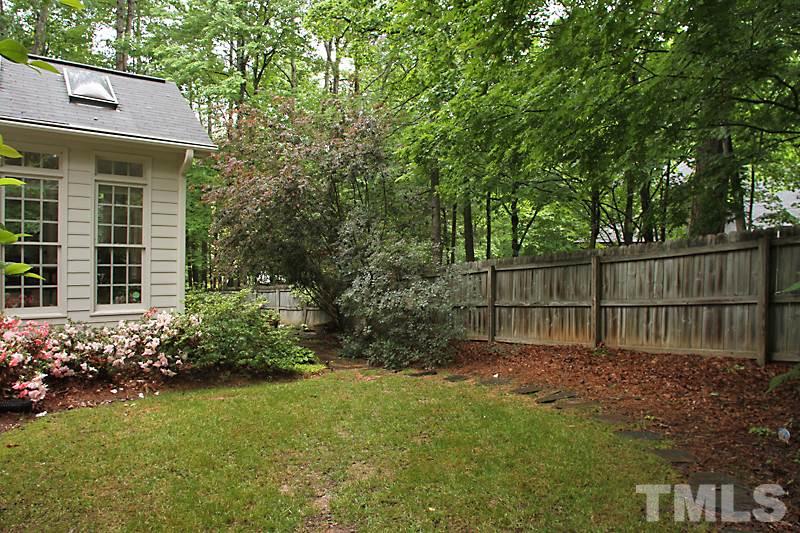 12301 Staunton Court Raleigh, NC 27613 - Photo 23 of 25 a garden with wooden fence