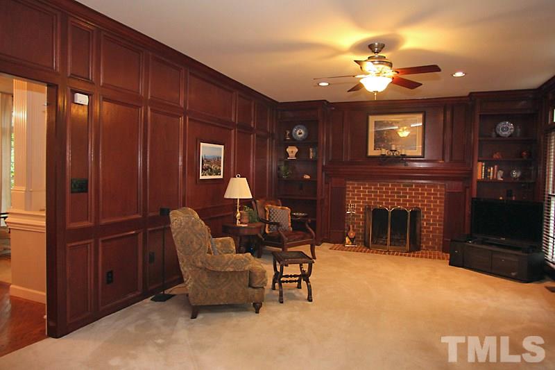 12301 Staunton Court Raleigh, NC 27613 - Photo 4 of 25 a living room with furniture and a fireplace