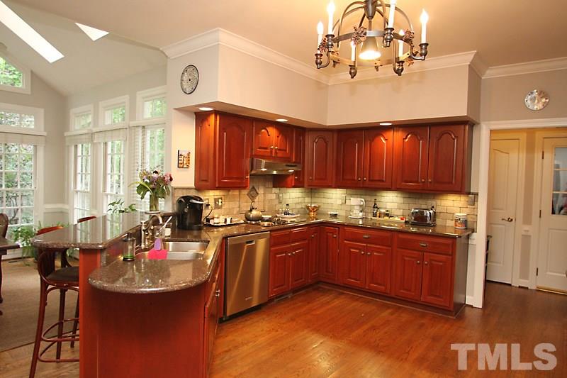 12301 Staunton Court Raleigh, NC 27613 - Photo 7 of 25 a kitchen with lots of counter top space