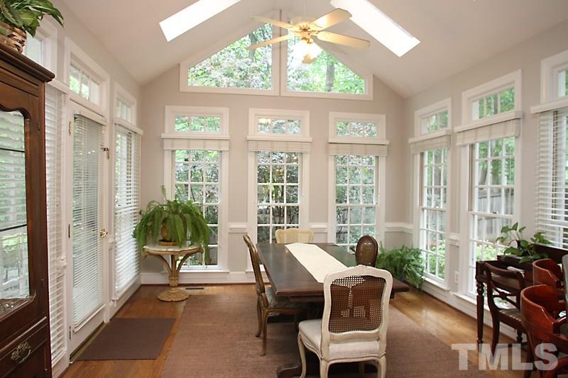 12301 Staunton Court Raleigh, NC 27613 - Photo 8 of 25 a living room with furniture and floor to ceiling windows