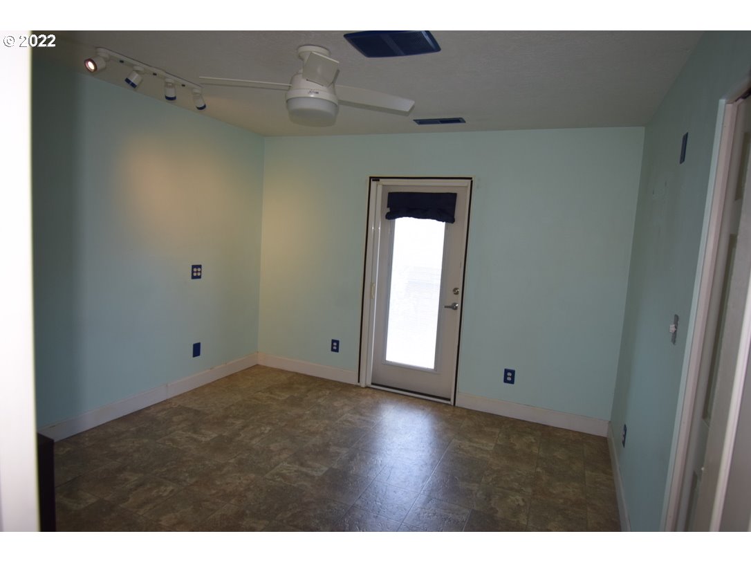 8717 Northeast Webster Street Portland, OR 97220 - Photo 16 of 30 a view of an empty room with window