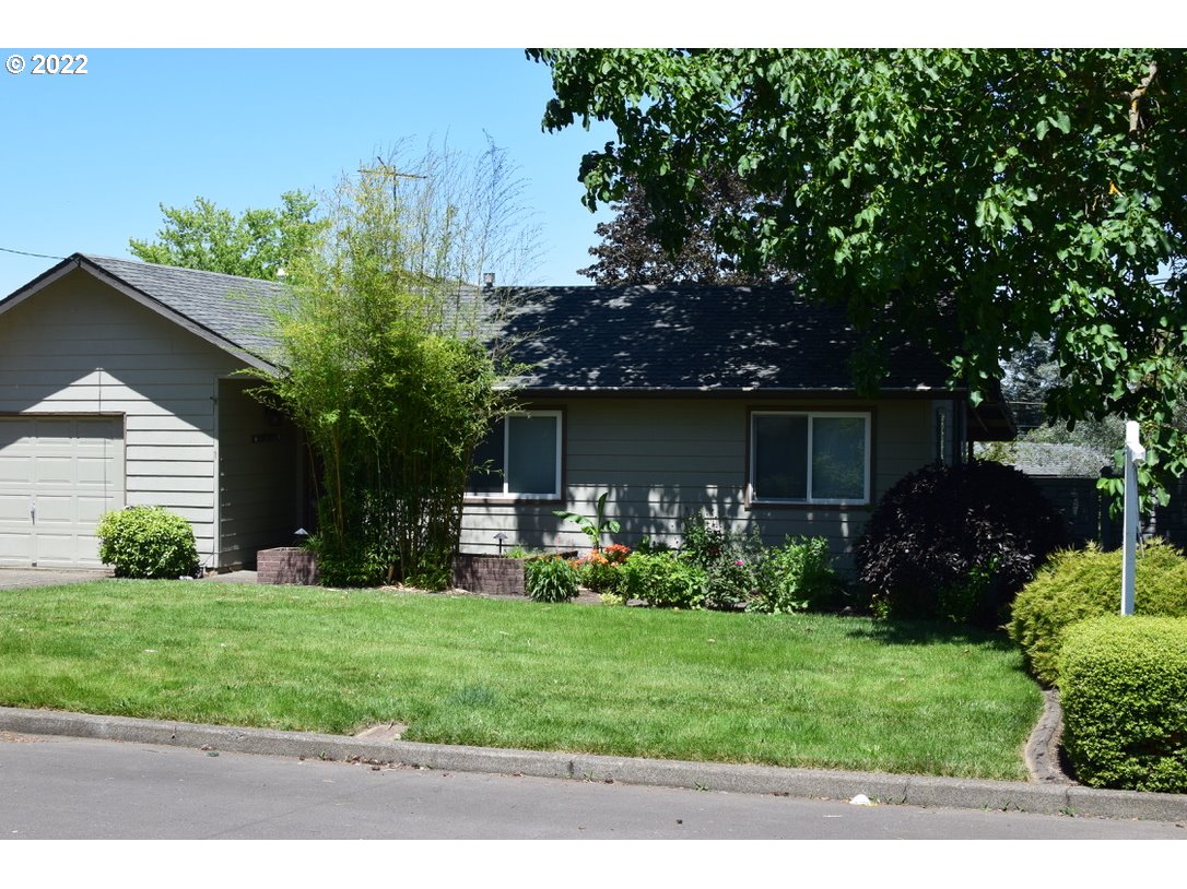 8717 Northeast Webster Street Portland, OR 97220 - Photo 3 of 30 a front view of house with yard and green space
