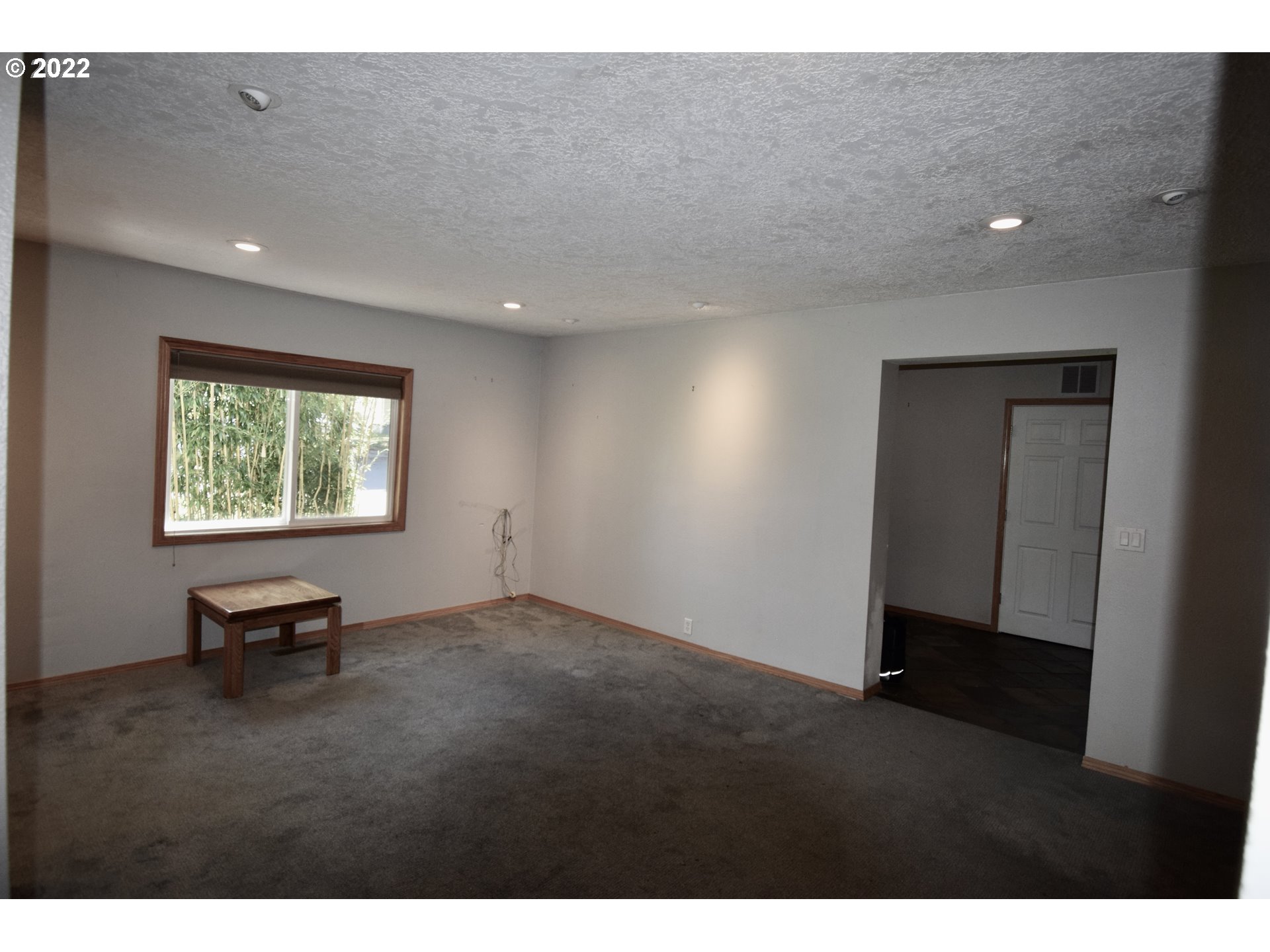 8717 Northeast Webster Street Portland, OR 97220 - Photo 4 of 30 a view of an empty room with a window