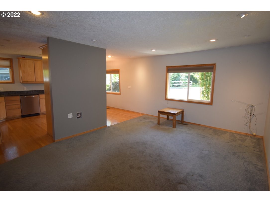 8717 Northeast Webster Street Portland, OR 97220 - Photo 5 of 30 a view of an empty room with a window
