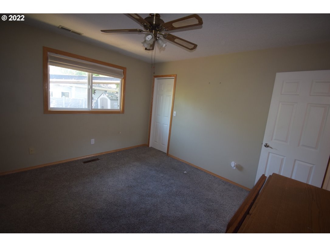 8717 Northeast Webster Street Portland, OR 97220 - Photo 10 of 30 a view of an empty room and a window