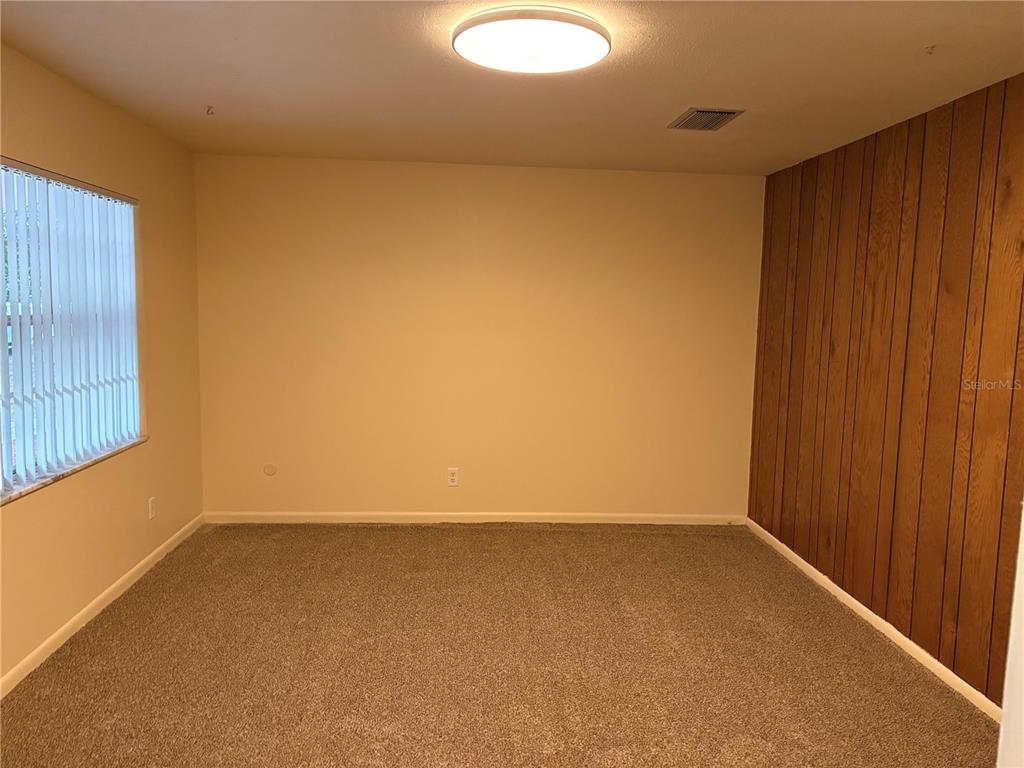 5107 East 120th Avenue Temple Terrace, FL 33617 - Photo 12 of 24 a view of an empty room