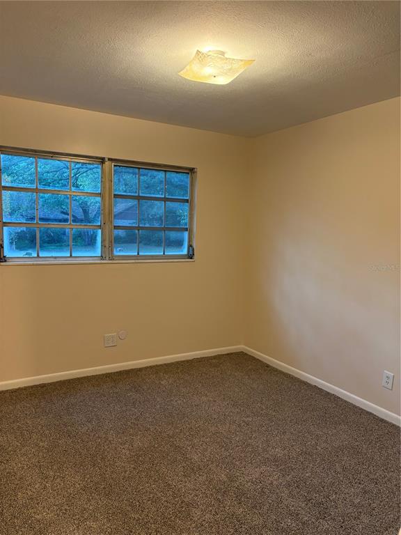 5107 East 120th Avenue Temple Terrace, FL 33617 - Photo 17 of 24 a view of an empty room