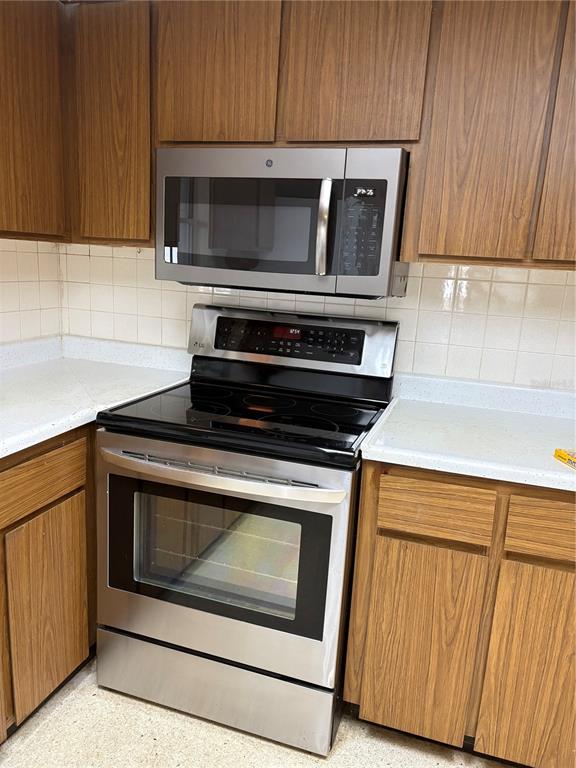 5107 East 120th Avenue Temple Terrace, FL 33617 - Photo 4 of 24 a stove top oven sitting inside of a kitchen