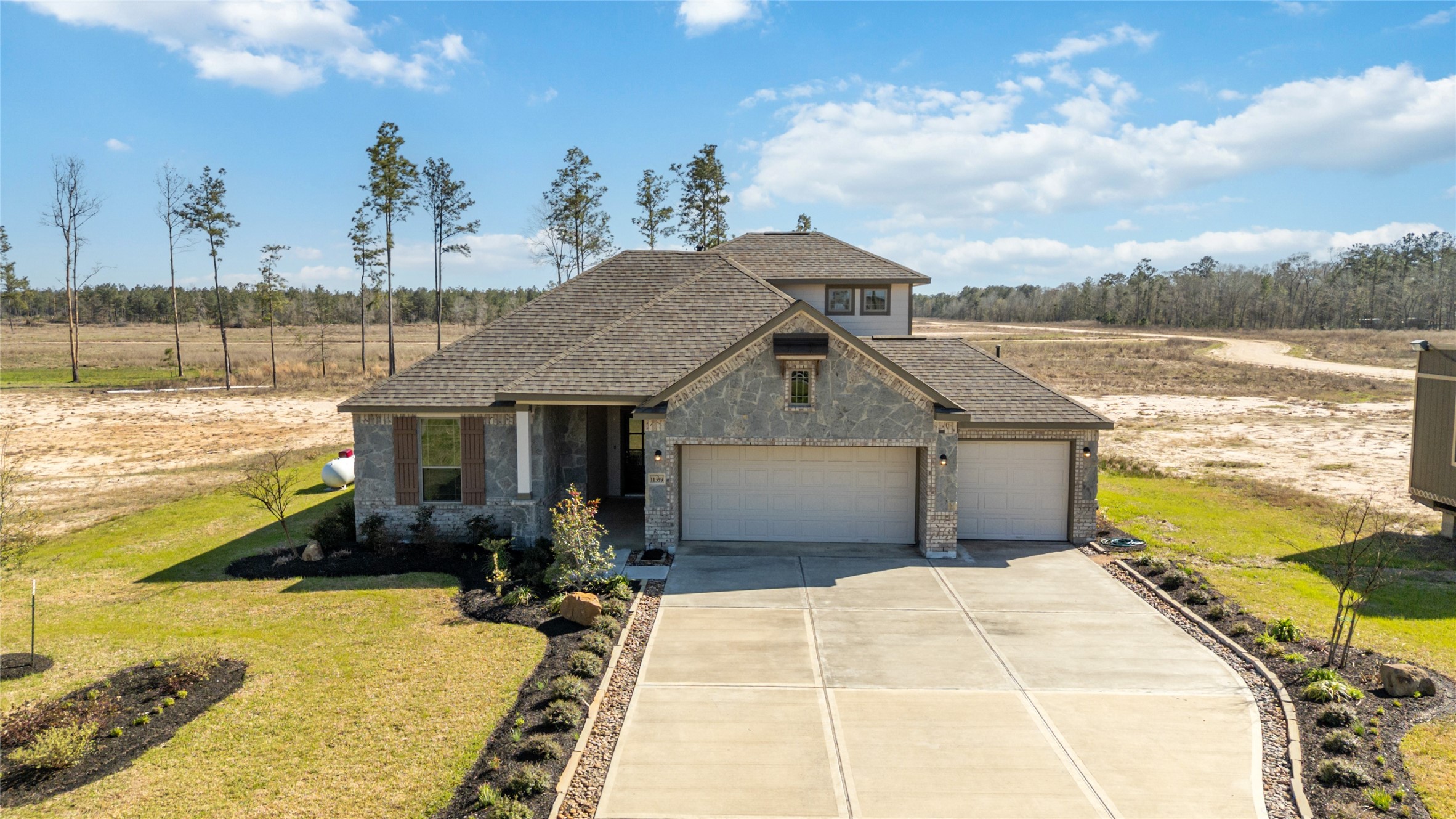 11359 White Rock Road Conroe, TX 77306 - Photo 27 of 31 a view of a house with outdoor space and sitting area