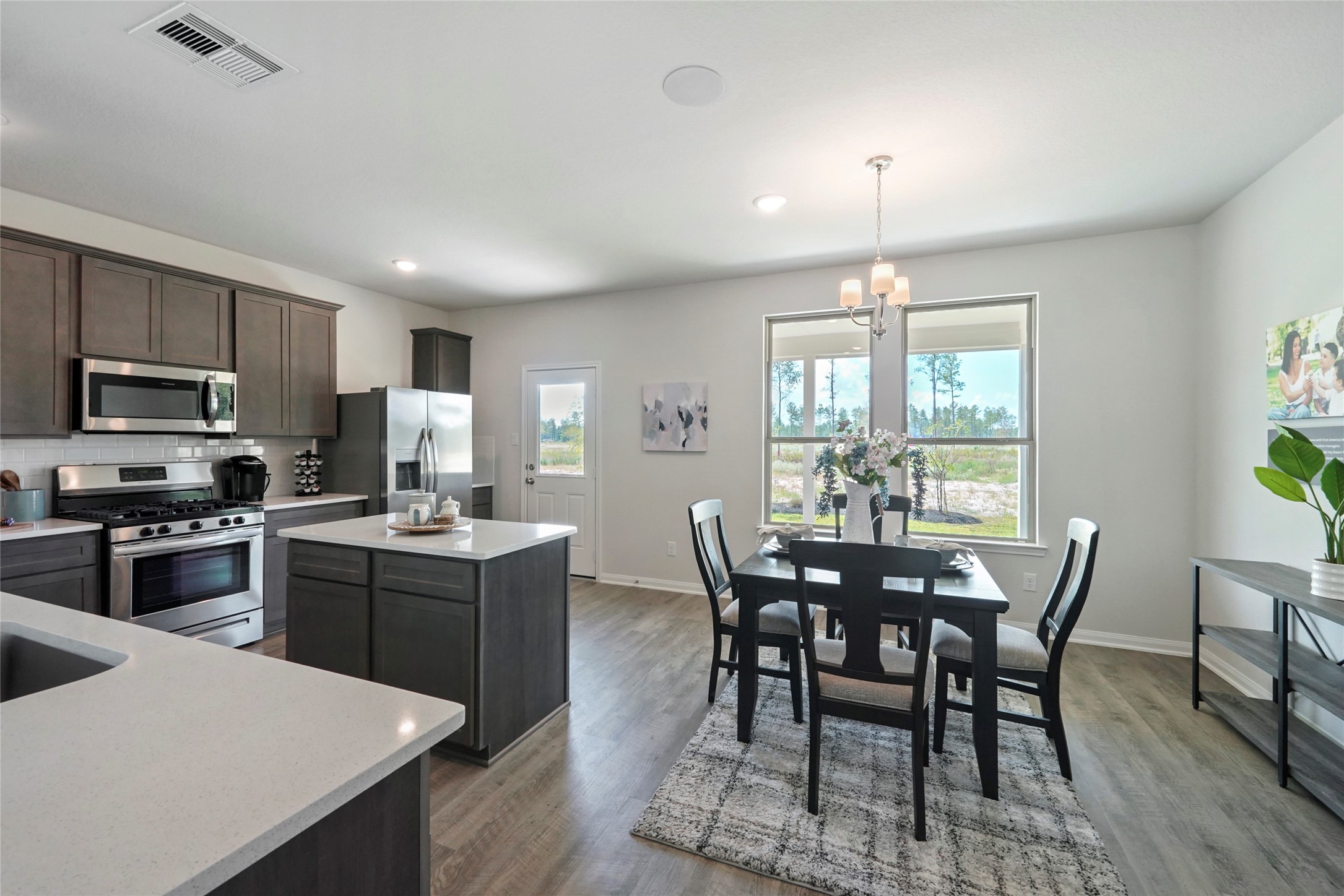 11359 White Rock Road Conroe, TX 77306 - Photo 10 of 31 a view of a dining room with furniture window and wooden floor