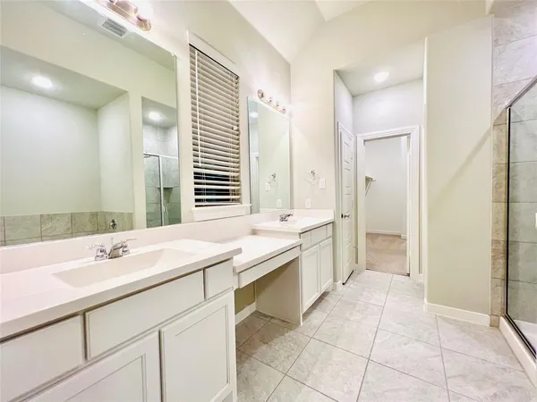 a bathroom with a granite countertop sink a toilet and a mirror