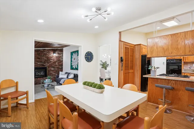 a view of kitchen island with furniture and wooden floor