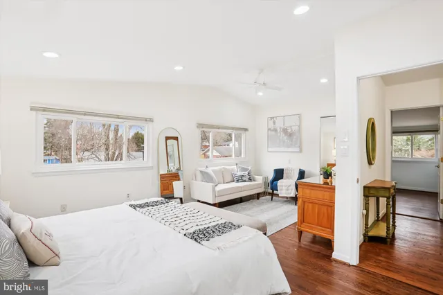 a bedroom with a large bed and a couch