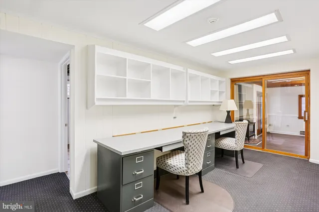 a living room with furniture window and wooden floor