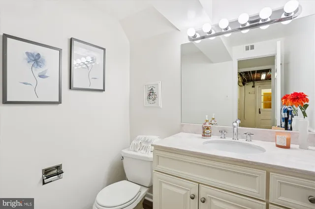 a view of a street with a wooden fence