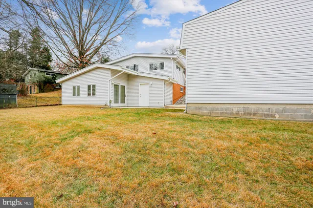a picture of a bench in front of a wall