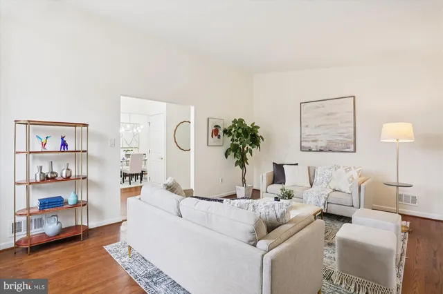 a living room with furniture and a table