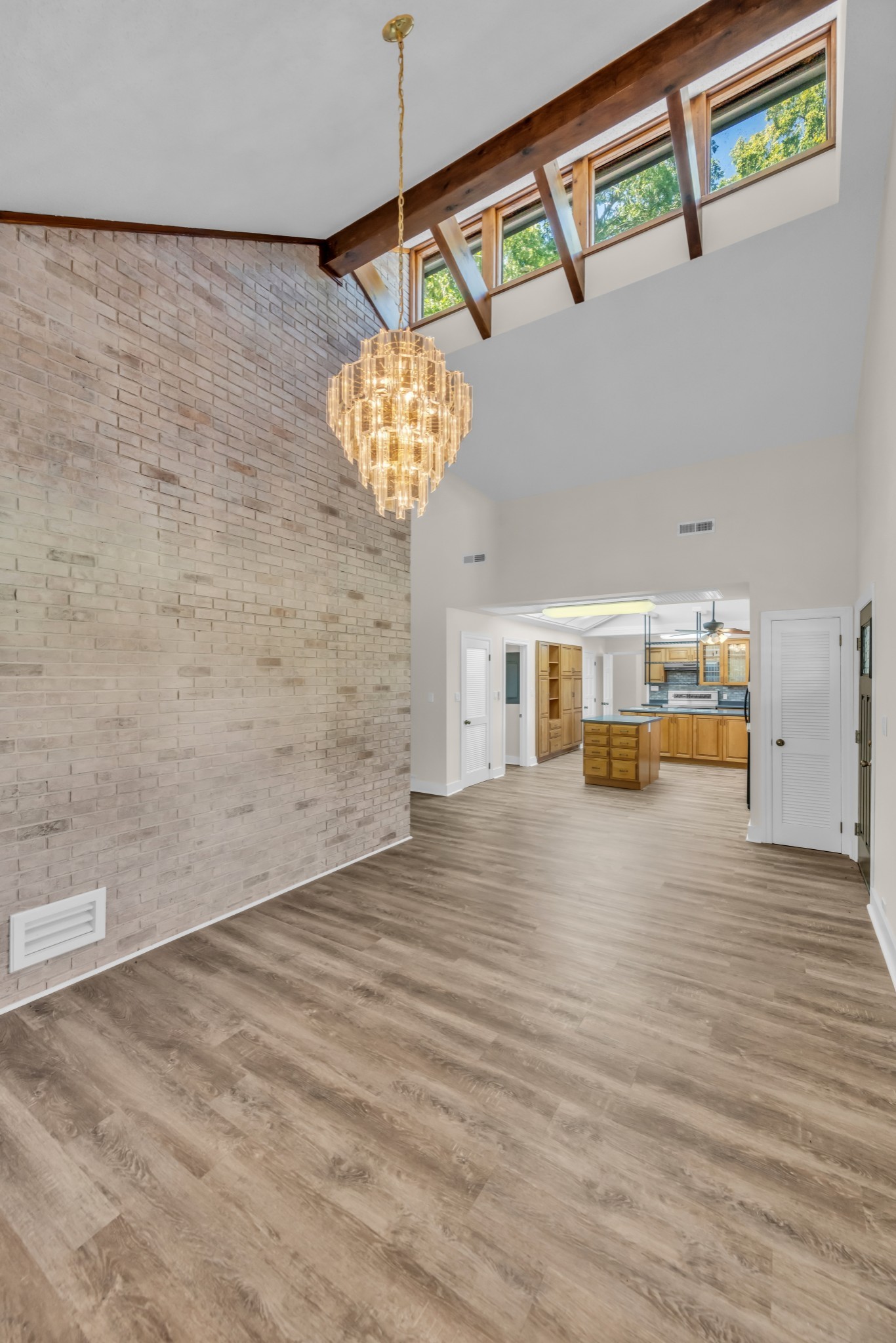 168 Oliver Smith Road Flintville, TN 37335 - Photo 12 of 86 a view of a room with wooden floor and chandelier