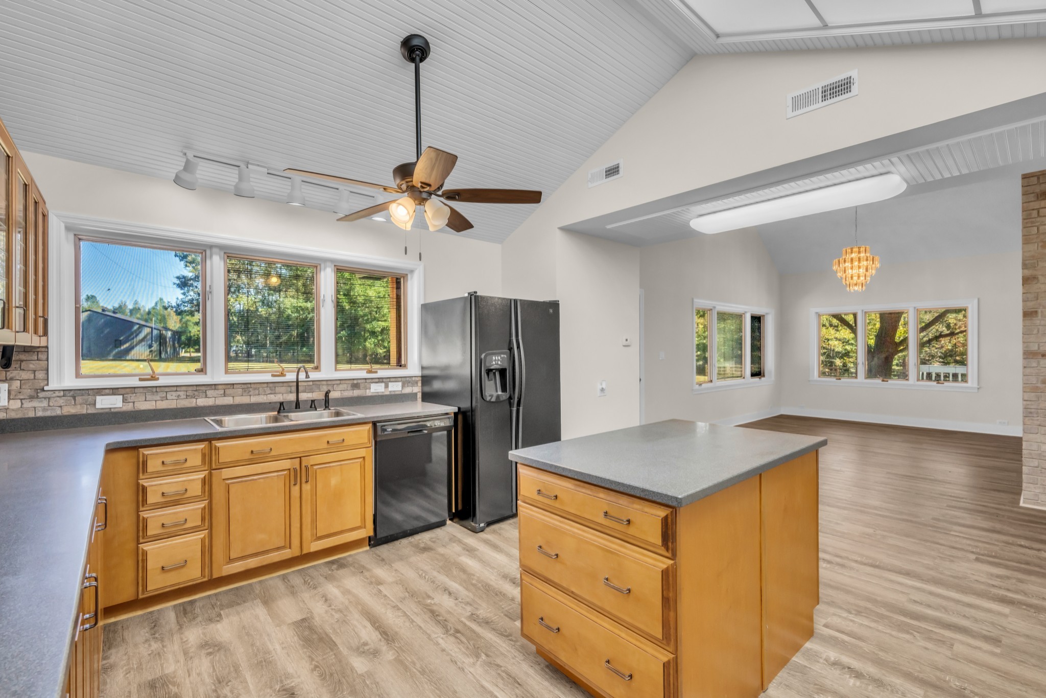 168 Oliver Smith Road Flintville, TN 37335 - Photo 15 of 86 a kitchen with stainless steel appliances granite countertop a stove a sink dishwasher and a refrigerator with wooden floor