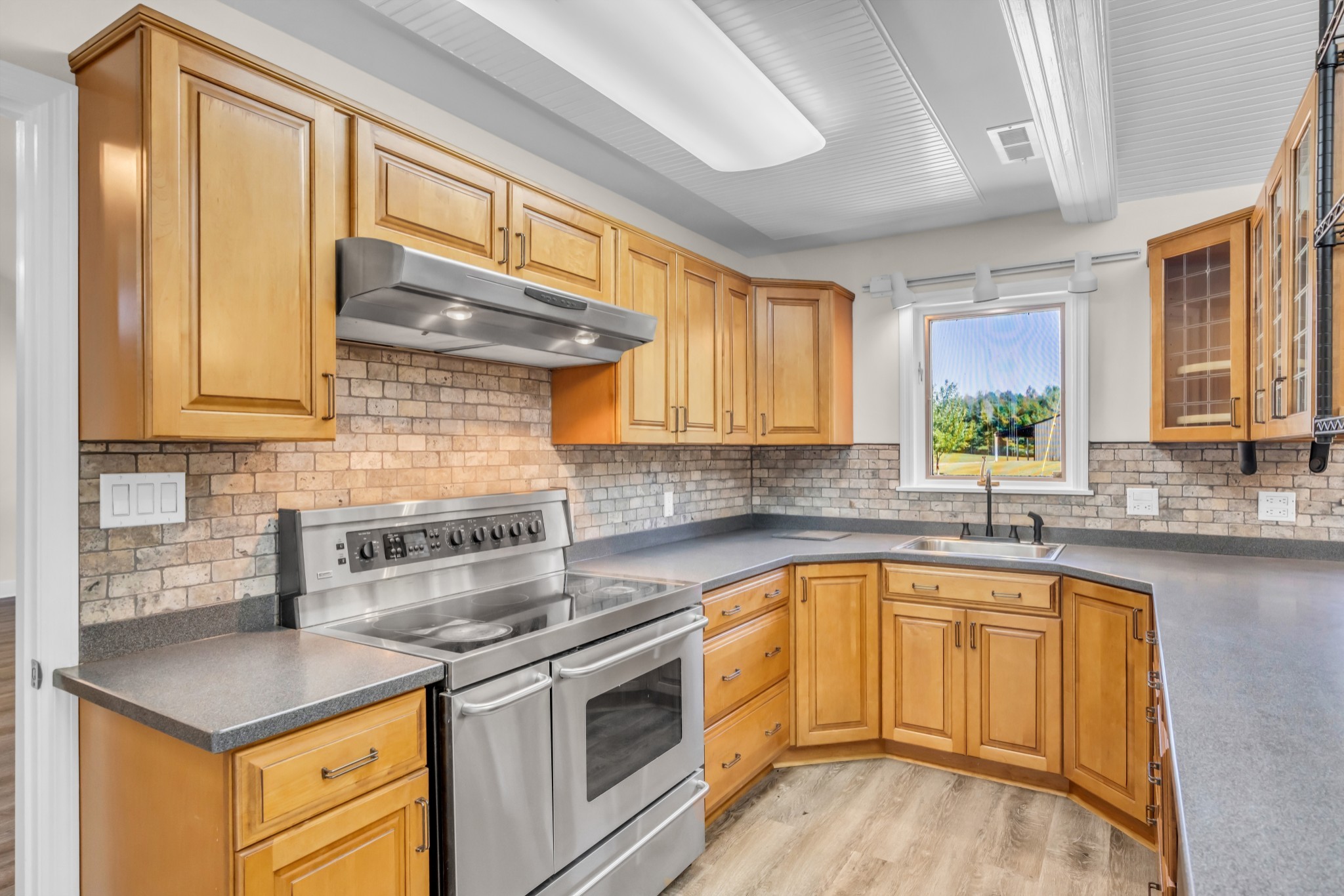 168 Oliver Smith Road Flintville, TN 37335 - Photo 16 of 86 a kitchen with a sink stove and cabinets