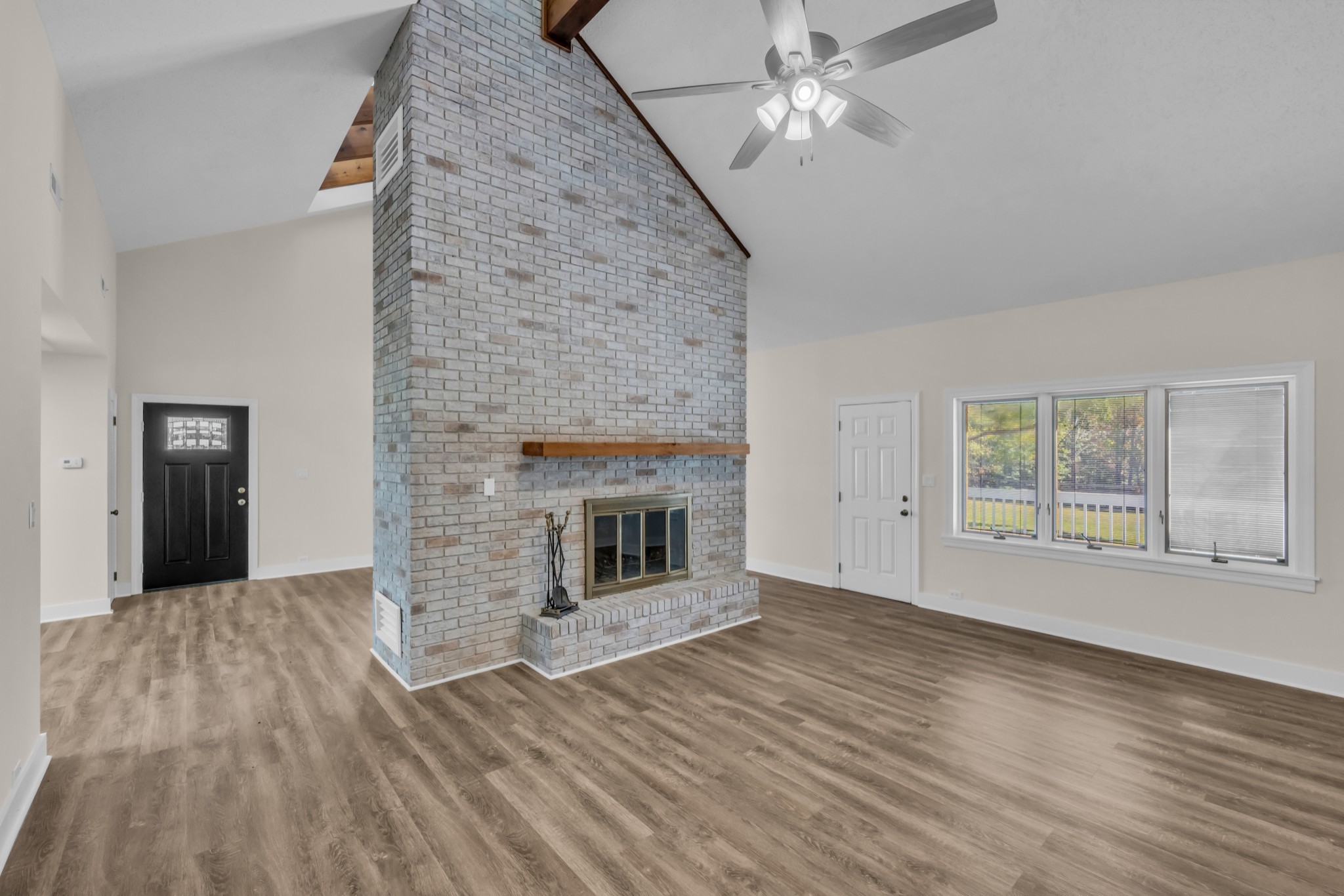 168 Oliver Smith Road Flintville, TN 37335 - Photo 20 of 86 wooden floor fireplace and natural light in room