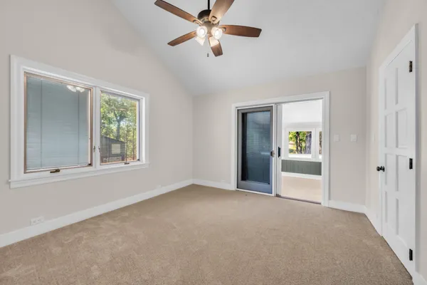 a view of an entryway with wooden floor