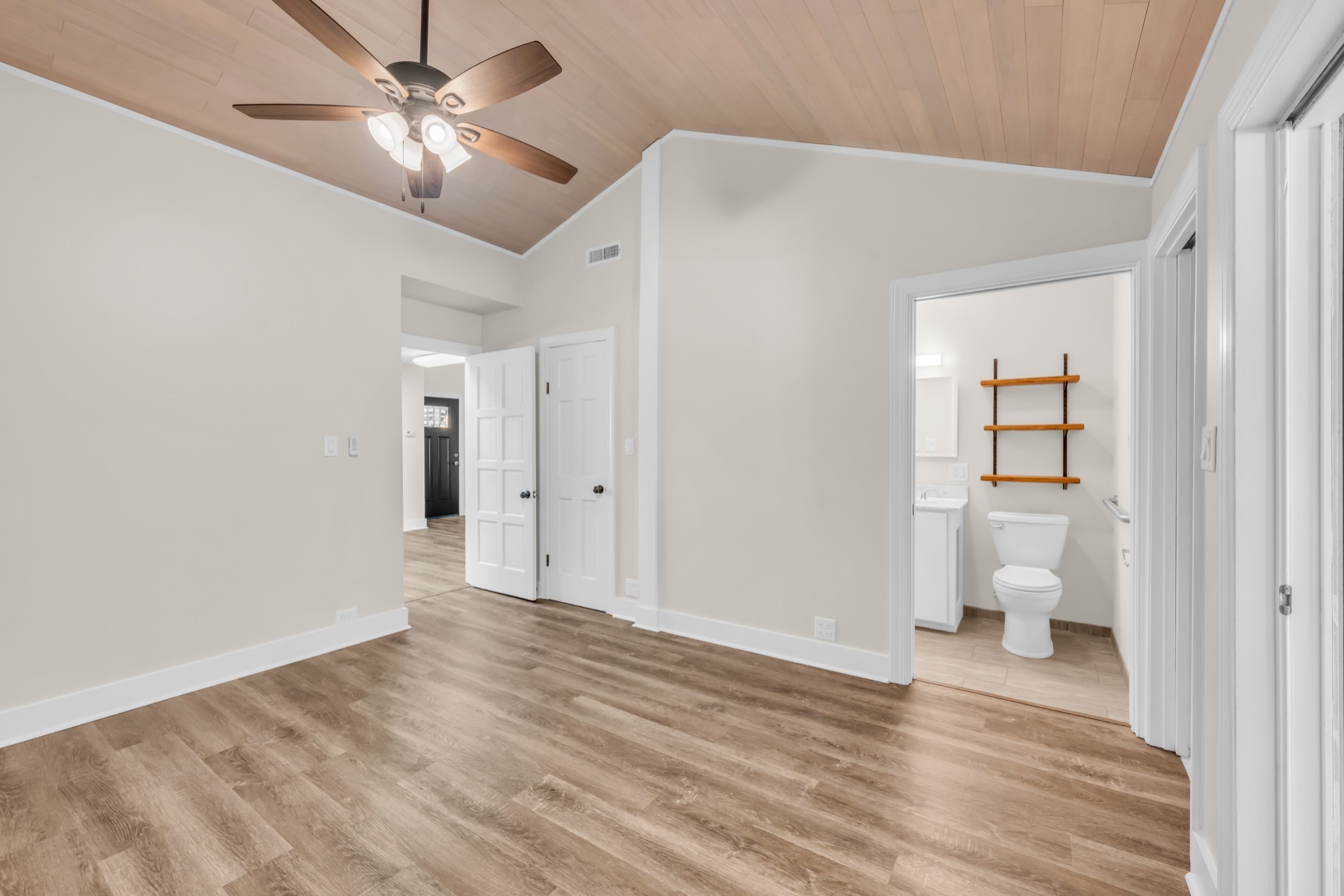 168 Oliver Smith Road Flintville, TN 37335 - Photo 40 of 86 a view of a big room with wooden floor and a ceiling fan