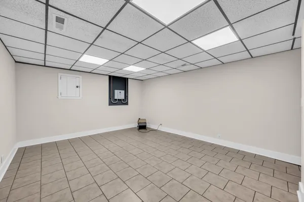 a view of an empty room with windows