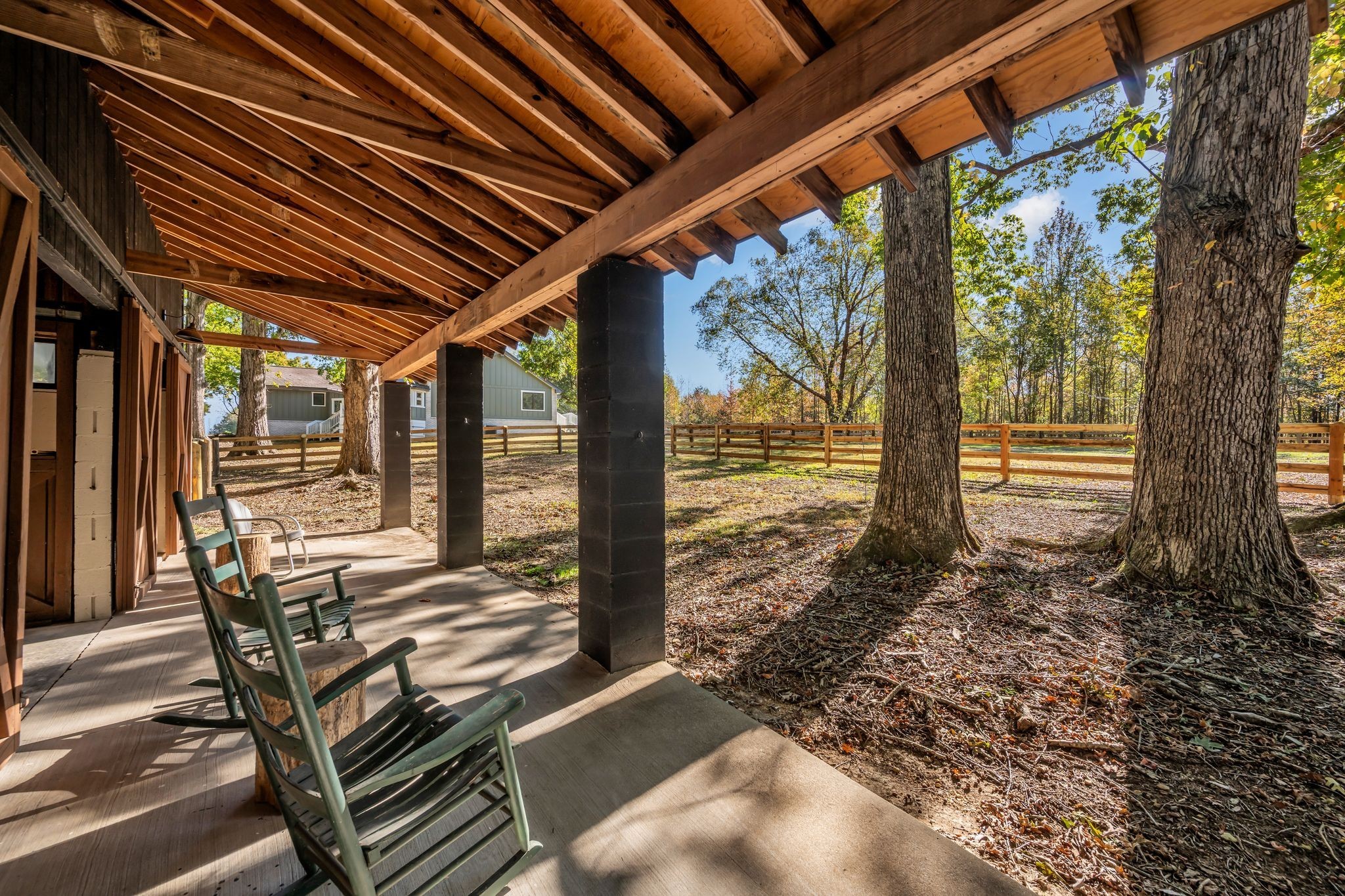 168 Oliver Smith Road Flintville, TN 37335 - Photo 55 of 86 a view of a patio with table and chairs a barbeque with wooden floor and roof with floor to ceiling window