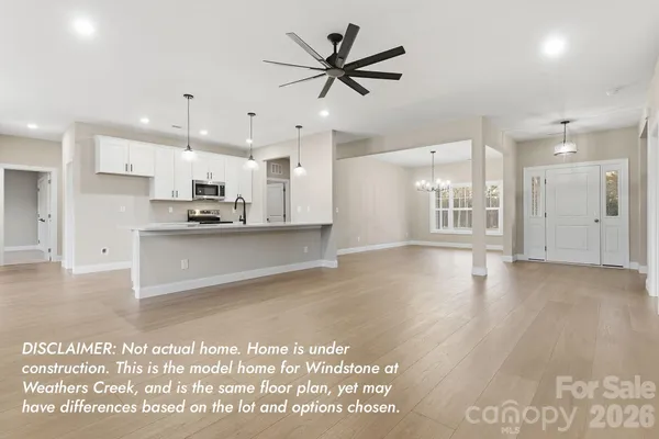 a view of a kitchen with a sink and cabinets