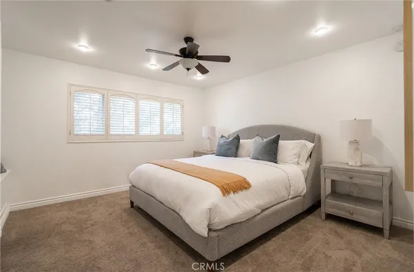 a bedroom with bed and window