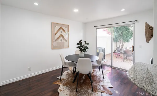 a view of a livingroom with furniture window and wooden floor