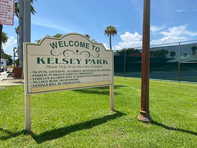 a view of a park that has a sign on the side