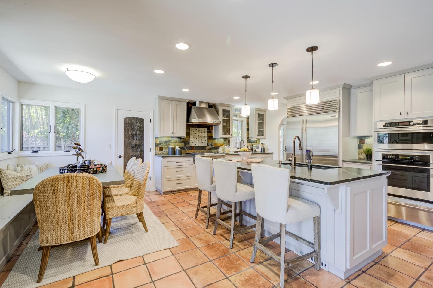 370 Quinnhill Road Los Altos, CA 94024 - Photo 20 of 58 a kitchen with stainless steel appliances kitchen island granite countertop a sink and cabinets