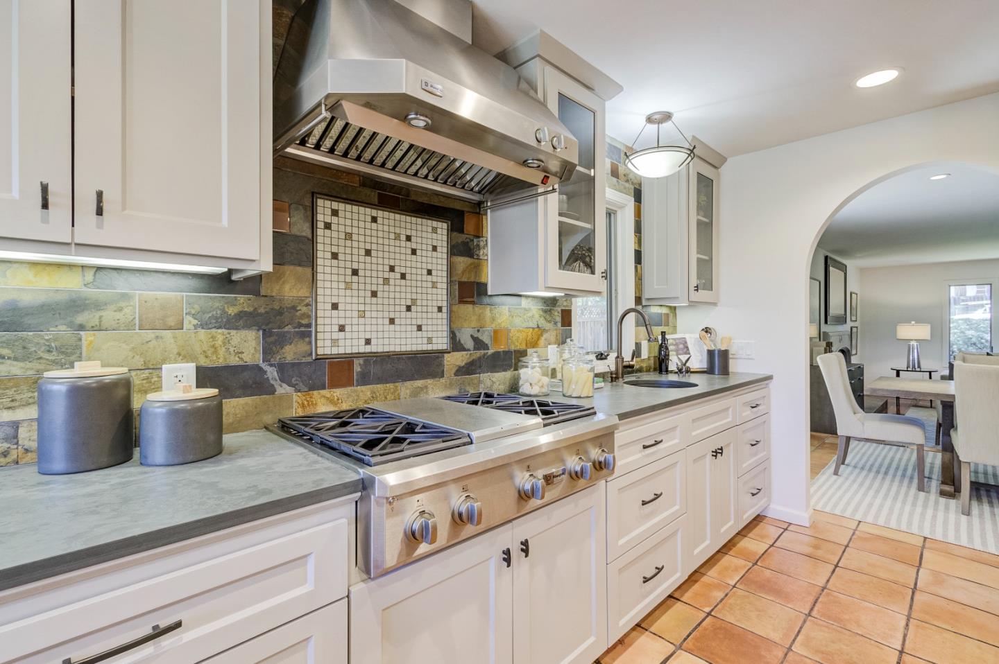 370 Quinnhill Road Los Altos, CA 94024 - Photo 24 of 58 a kitchen with granite countertop a sink stove and cabinets