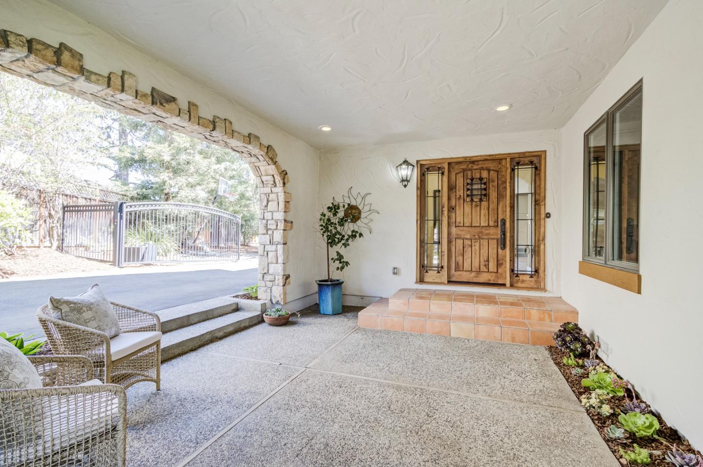 370 Quinnhill Road Los Altos, CA 94024 - Photo 3 of 58 a spacious bedroom with a large bed and large windows