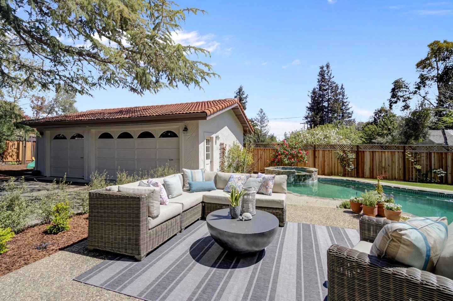 370 Quinnhill Road Los Altos, CA 94024 - Photo 51 of 58 a living room with furniture and a wooden floor