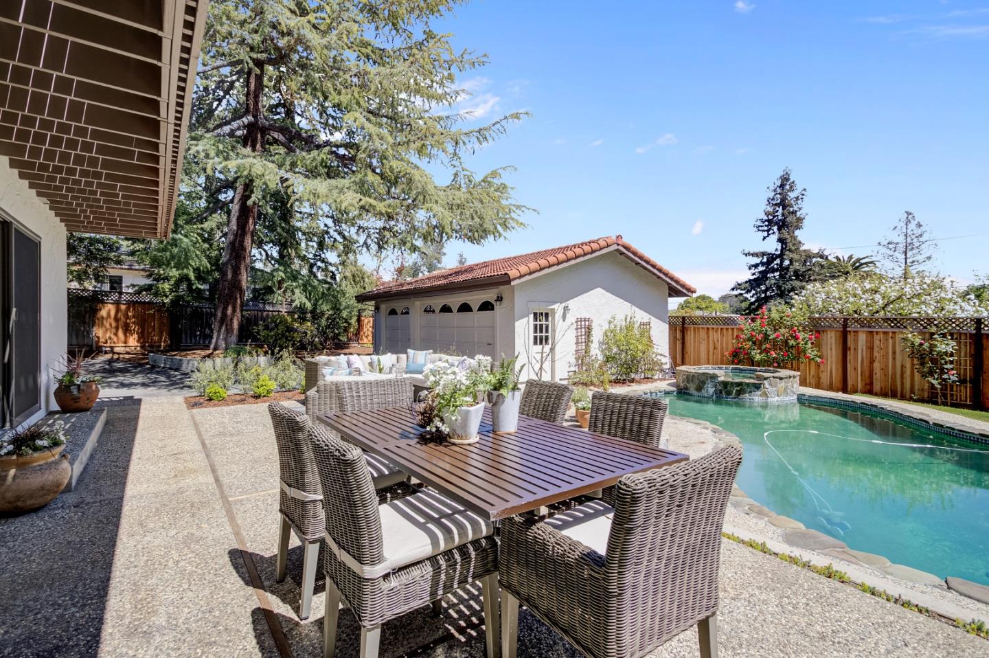 370 Quinnhill Road Los Altos, CA 94024 - Photo 52 of 58 a view of a patio with table and chairs a fire pit and a yard
